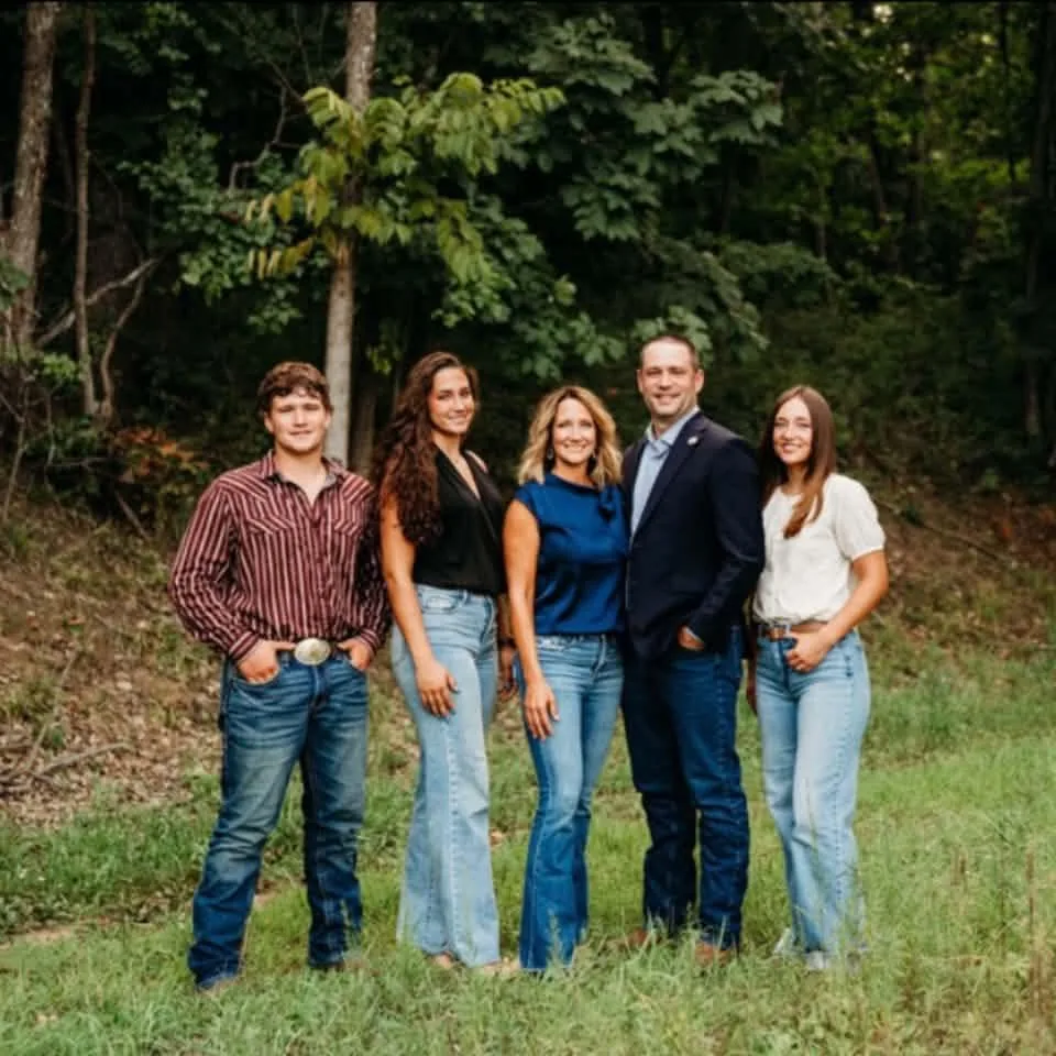 Sean Willcott with his family outdoors